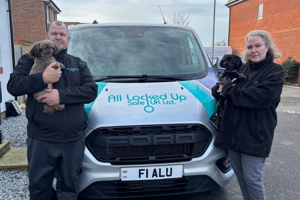 All Locked Up Safe mobile locksmith team beside the branded service van